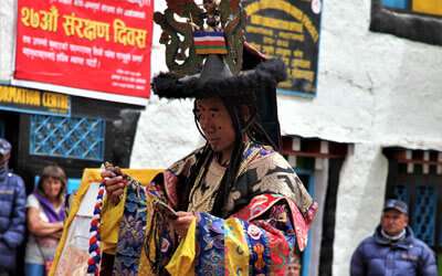 Monk getting ready to perform at Tiji Festival